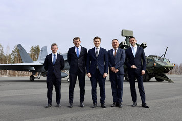 The nordic defence ministers standing next to each outside.
