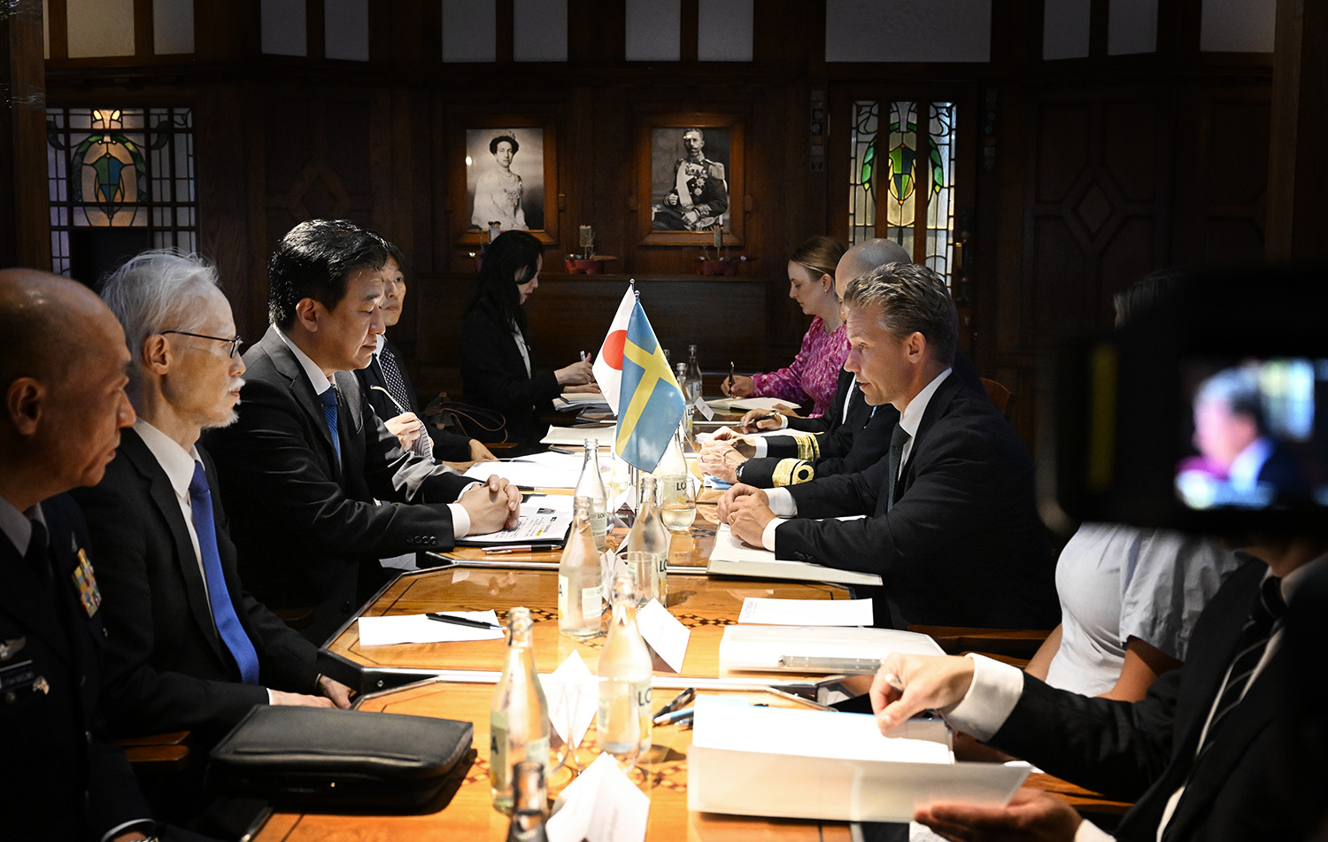 The ministers at a meeting table.